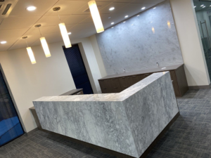 Marble facade reception desk and wall corporate office